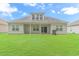 House exterior with a spacious backyard at 1616 Sapphire Dr., Longs, SC 29568
