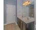 Double vanity bathroom with dark wood cabinets and tiled floor at 1616 Sapphire Dr., Longs, SC 29568