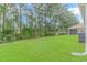 Large backyard with lush green grass at 1616 Sapphire Dr., Longs, SC 29568