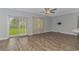 Spacious living room with wood-look flooring and sliding glass doors at 1616 Sapphire Dr., Longs, SC 29568