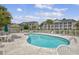 Community pool with plenty of lounge chairs and tables at 5040 Windsor Green Way # 302, Myrtle Beach, SC 29579