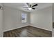 Bright bedroom with ceiling fan and wood-look flooring at 5040 Windsor Green Way # 302, Myrtle Beach, SC 29579