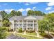 Three-story building with multiple balconies and ample parking at 5040 Windsor Green Way # 302, Myrtle Beach, SC 29579