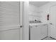 Convenient laundry room with washer, dryer, and shelving at 5040 Windsor Green Way # 302, Myrtle Beach, SC 29579