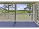Screened porch overlooks a lush green landscape at 5040 Windsor Green Way # 302, Myrtle Beach, SC 29579