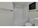 Clean bathroom with a tub and shower, toilet, and updated fixtures at 5040 Windsor Green Way # 302, Myrtle Beach, SC 29579
