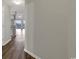 Hallway leading into a spacious living area with hardwood floors at 5040 Windsor Green Way # 302, Myrtle Beach, SC 29579