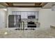 Modern kitchen with granite countertops and stainless steel appliances at 5040 Windsor Green Way # 302, Myrtle Beach, SC 29579