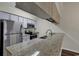 Modern kitchen with granite countertops and stainless steel appliances at 5040 Windsor Green Way # 302, Myrtle Beach, SC 29579