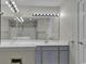 Bathroom features double sinks, a large mirror, and updated light fixtures at 5040 Windsor Green Way # 302, Myrtle Beach, SC 29579