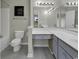 Bathroom with double vanity, large mirror, and a tub shower combo at 5040 Windsor Green Way # 302, Myrtle Beach, SC 29579