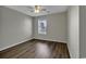 Bright bedroom with wood-look floors and a ceiling fan at 5040 Windsor Green Way # 302, Myrtle Beach, SC 29579
