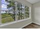 Bedroom window view overlooking a lush green landscape at 5040 Windsor Green Way # 302, Myrtle Beach, SC 29579