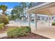 Community pool area with covered seating and landscaping at 5040 Windsor Green Way # 302, Myrtle Beach, SC 29579