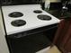 White electric stove with four burners and a black oven at 1501 S Ocean Blvd. # 848, Myrtle Beach, SC 29577