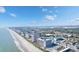 Aerial view of coastline, beach, ocean, high rise buildings and pier at 1501 S Ocean Blvd. # 848, Myrtle Beach, SC 29577