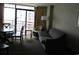 Living room with sofa, table, chairs, and balcony access at 1501 S Ocean Blvd. # 848, Myrtle Beach, SC 29577