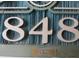 House number 848 on a carved wooden sign at 1501 S Ocean Blvd. # 848, Myrtle Beach, SC 29577