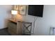 Wooden TV stand with drawers and a lamp at 1501 S Ocean Blvd. # 848, Myrtle Beach, SC 29577