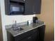 Small kitchenette with microwave, sink, and mini-fridge at 1501 S Ocean Blvd. # 1020, Myrtle Beach, SC 29577