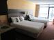 Hotel bedroom with two double beds, kitchenette, and balcony access at 1501 S Ocean Blvd. # 1020, Myrtle Beach, SC 29577