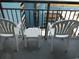 Balcony with two chairs and a small table at 1501 S Ocean Blvd. # 1020, Myrtle Beach, SC 29577