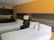 Two beds in a hotel room with a kitchenette and modern decor at 1501 S Ocean Blvd. # 1020, Myrtle Beach, SC 29577