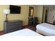 Hotel bedroom with two beds and kitchenette at 1501 S Ocean Blvd. # 1020, Myrtle Beach, SC 29577