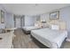 Two twin beds, dresser, and small table with chairs in a bright bedroom at `1207 S Ocean Blvd. # 51512, Myrtle Beach, SC 29577