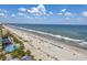 Aerial view of the beach and resort including the pool at `1207 S Ocean Blvd. # 51512, Myrtle Beach, SC 29577
