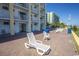 Brick patio with white chairs near the beach at `1207 S Ocean Blvd. # 51512, Myrtle Beach, SC 29577