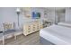 Two twin beds, dresser, and small table with chairs in a bright bedroom at `1207 S Ocean Blvd. # 51512, Myrtle Beach, SC 29577