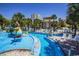Another view of the lazy river style pool with lounge chairs at `1207 S Ocean Blvd. # 51512, Myrtle Beach, SC 29577