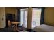 Two beds, small table, balcony access at 2701 S Ocean Blvd. # 1410, North Myrtle Beach, SC 29582