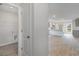 Laundry room with white shelving and gray flooring at 116 Arbor Crest Ln., Tabor City, NC 28463