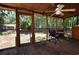 Relaxing screened porch overlooks the backyard at 553 Martin Luther King Rd., Pawleys Island, SC 29585