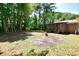 Spacious backyard with mature trees and a wooden deck at 553 Martin Luther King Rd., Pawleys Island, SC 29585
