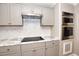 Kitchen boasts stainless steel appliances and marble countertops at 553 Martin Luther King Rd., Pawleys Island, SC 29585