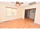 Hardwood floor bedroom with window and ceiling fan at 553 Martin Luther King Rd., Pawleys Island, SC 29585