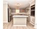 Modern kitchen with island, stainless steel appliances, and updated cabinetry at 553 Martin Luther King Rd., Pawleys Island, SC 29585