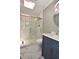 Updated bathroom features a walk-in shower, marble tile, and modern vanity at 553 Martin Luther King Rd., Pawleys Island, SC 29585