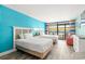 Two beds, light wood floors, and blue and green walls at 1501 S Ocean Blvd. # 904, Myrtle Beach, SC 29577