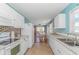 Bright kitchen with white cabinets, granite counters, and stainless steel appliances at 6001- 1029 S Kings Hwy., Myrtle Beach, SC 29575