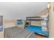Upstairs bedroom with twin-over-twin bunk bed and single bed at 6001- 1029 S Kings Hwy., Myrtle Beach, SC 29575