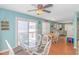 Dining area with glass table, white chairs and view into the kitchen at 6001- 1029 S Kings Hwy., Myrtle Beach, SC 29575