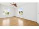 Bright bedroom with hardwood floors and ceiling fan at 800 9Th Ave. S # T-4, North Myrtle Beach, SC 29582