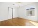 Bedroom with hardwood floors, ceiling fan, and closet at 800 9Th Ave. S # T-4, North Myrtle Beach, SC 29582