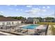 Inviting community pool area with surrounding patio furniture at 800 9Th Ave. S # T-4, North Myrtle Beach, SC 29582