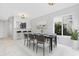 Dining room with tile floors, modern table and chairs, and kitchen view at 800 9Th Ave. S # T-4, North Myrtle Beach, SC 29582