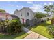 Two-story townhome with red door, landscaping, and fenced backyard at 800 9Th Ave. S # T-4, North Myrtle Beach, SC 29582